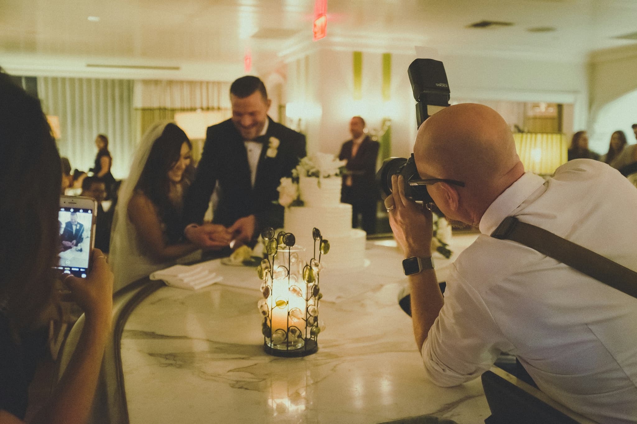 Bride, groom, and guests at a wedding